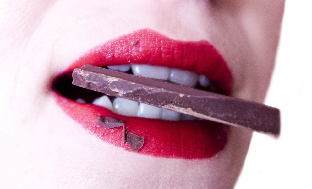 biting chocolate